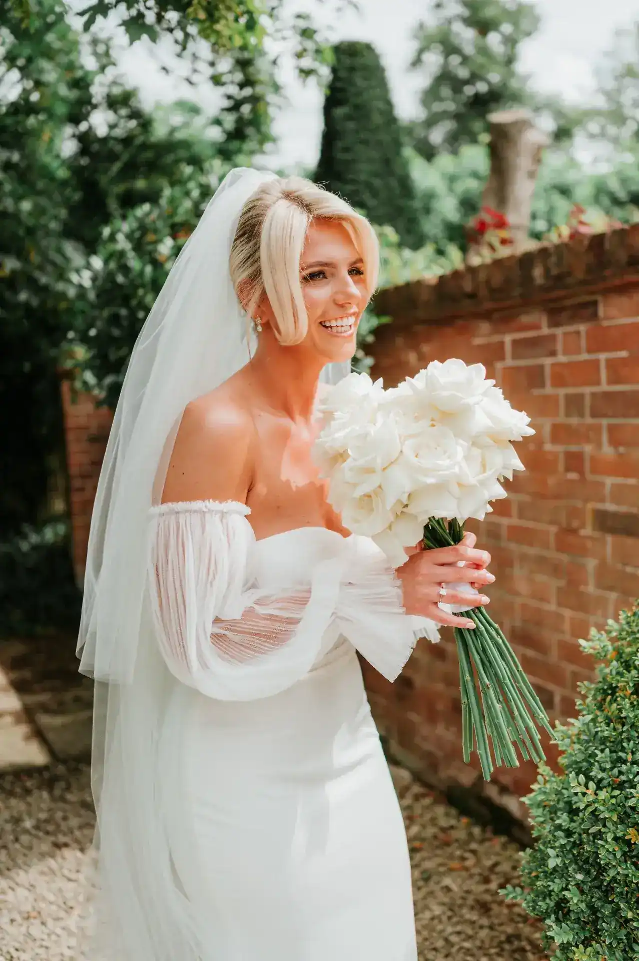 Happy bride and groom on their wedding day with bridal hair and makeup by Jodie Elleanor